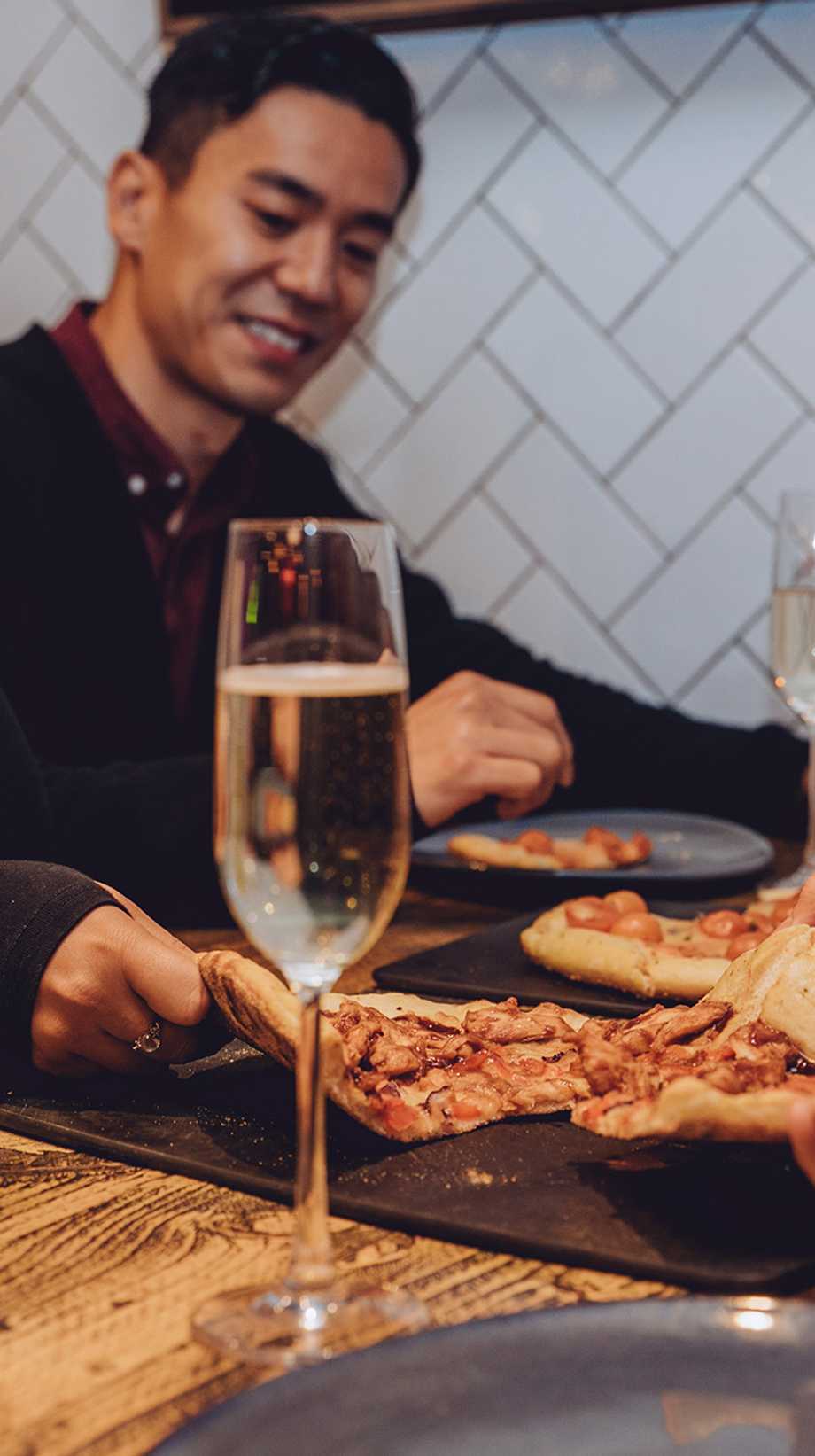 A table of guests are sharing a bottomless alongside glasses of Prosecco and Guinness.