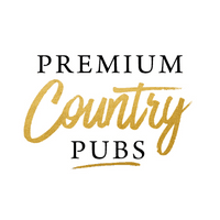 The Premium Country Pubs logo. 'Premium' and 'Pubs' are written in a bold, serif font, while 'Country' is scrawled in gold in the centre. Underneath 'Pubs' is a gold underline.