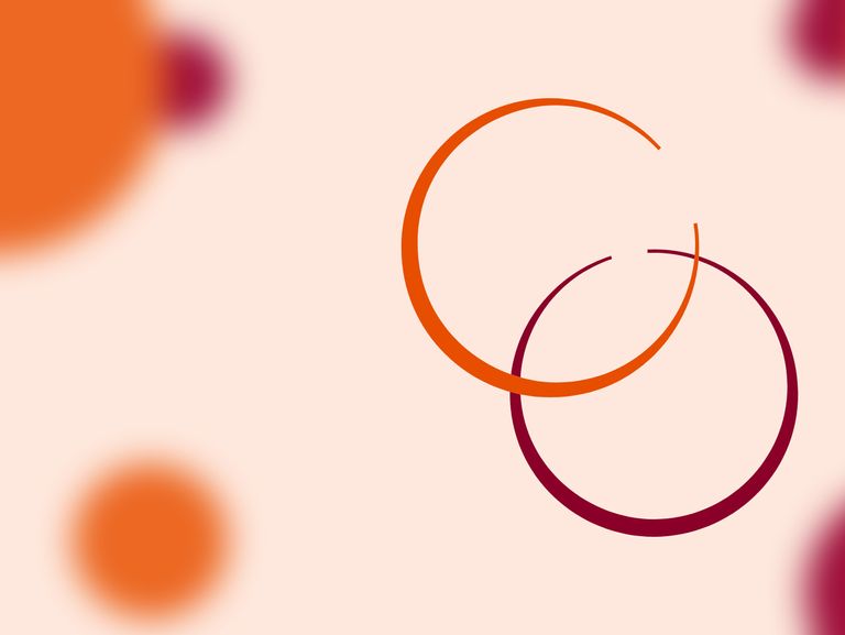 In the foreground, an orange circle overlaps a maroon circle - they resemble rings left behind by drinks. In the background, solid circles of colour are out of focus.