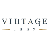 The Vintage Inns logo. 'Vintage' is written in a serif font with a golden shadow. Underneath, 'Inns' is written between two lines of gold.