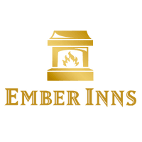 The Ember Inns' logo, with "EMBER INNS" written in a bold, golden font underneath a golden fireplace with a shiny effect.